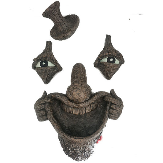 Radiant bark monster face bird feeder manual facial resin ornament